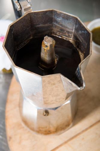 a metal box with a bell in it on a table at Le Rondini in Bagnolo Mella