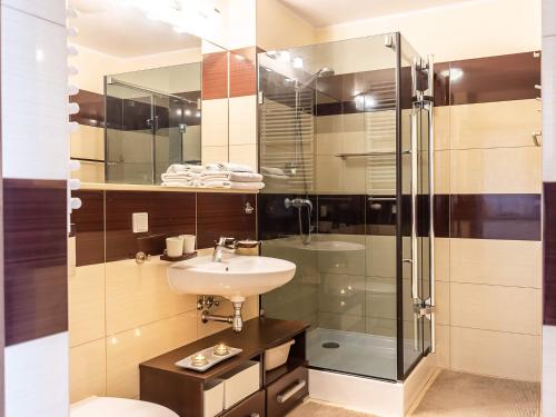 Ванная комната в VacationClub – Olympic Park Apartament A412
