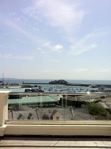 a view of the ocean from the balcony of a building at La Fregate Hotel in St Peter Port