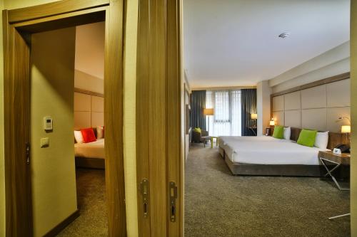 Ένα ή περισσότερα κρεβάτια σε δωμάτιο στο ibis Styles Istanbul Bomonti