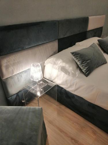 a bedroom with a bed with a glass table at BARI 102 in Bari