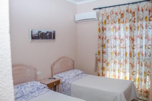 Ένα ή περισσότερα κρεβάτια σε δωμάτιο στο pension hernandez