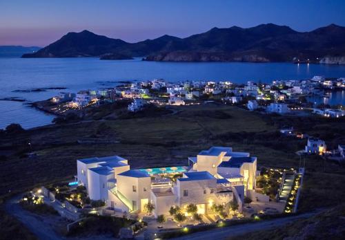 an aerial view of a city at night at Milos Breeze Boutique Hotel in Pollonia