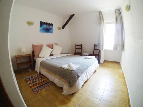 a bedroom with a bed and a large mirror at Bohemian Spirit, Vama Veche in Vama Veche