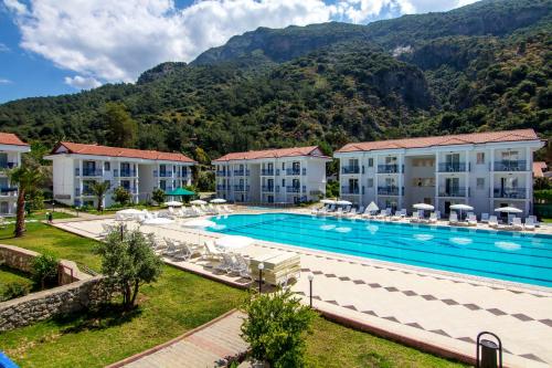 an image of a swimming pool at a resort at Belcekum Beach Hotel in Oludeniz