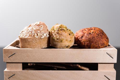 a box with four different types of bread at Boutique Hotel Boškinac in Novalja