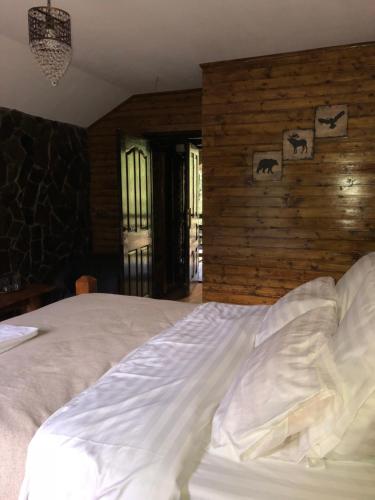 Postel nebo postele na pokoji v ubytování Cabana Zimbru Transfagarasan