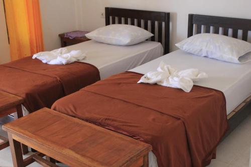 Ένα ή περισσότερα κρεβάτια σε δωμάτιο στο EJA GUEST HOUSE