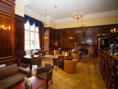 The lounge or bar area at Lynford Hall Hotel 