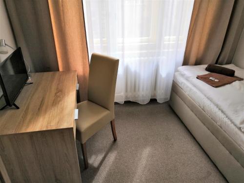 Postel nebo postele na pokoji v ubytování Hotel Marianeum