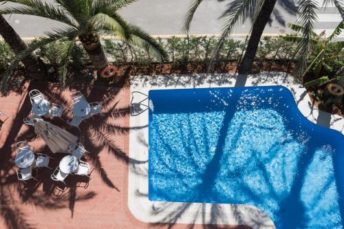 Πισίνα στο ή κοντά στο Hotel El Palmeral