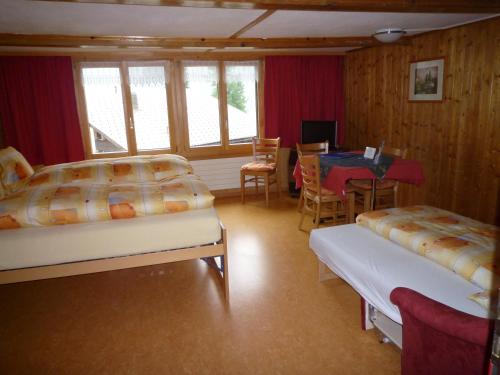 Ένα ή περισσότερα κρεβάτια σε δωμάτιο στο Esthers Guesthouse