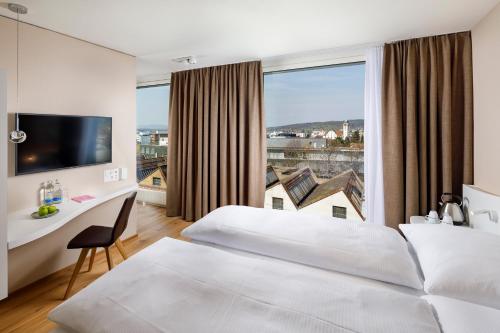 מיטה או מיטות בחדר ב-Hotel Allegra Lodge
