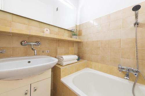 a bathroom with a sink and a shower at P&O Apartments Plac Zbawiciela in Warsaw