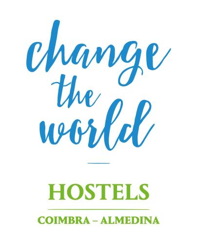 a sign that reads change the world in cursive handwriting at Change The World Hostels - Coimbra - Almedina in Coimbra