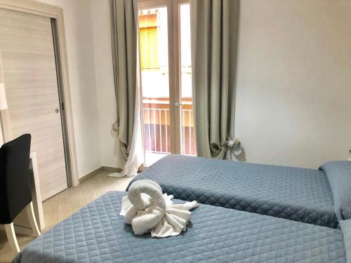 Ένα ή περισσότερα κρεβάτια σε δωμάτιο στο Belvedere Rent Rooms