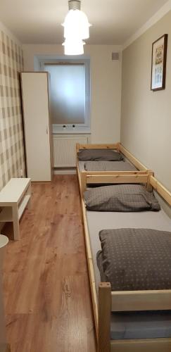 Ένα ή περισσότερα κρεβάτια σε δωμάτιο στο Próchnika 49 Rooms