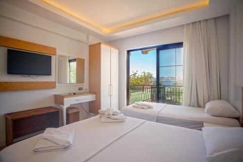 Un pat sau paturi într-o cameră la Hotel Ferah
