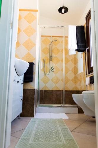a bathroom with a shower and a sink at Is Seddas B&B in Bari Sardo