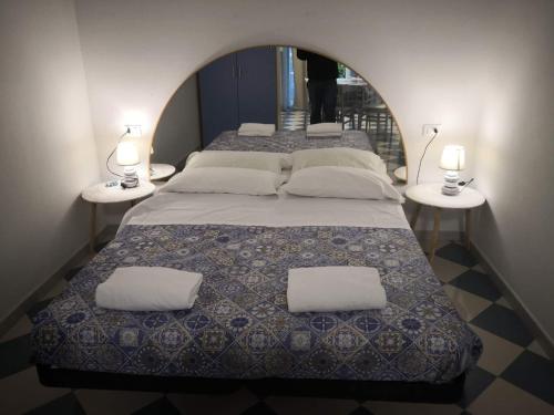 En eller flere senge i et værelse på Residence BluAdria