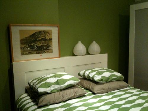 a bedroom with two pillows on a bed at Casa do Cais Cerveira in Vila Nova de Cerveira