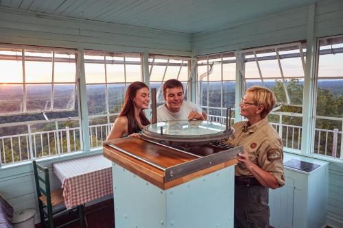 a group of people standing in a room at Cumberland Falls State Resort Park in Honeybee
