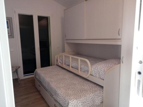 Postelja oz. postelje v sobi nastanitve Appartamento Leccino con piscina - Riva Trigoso
