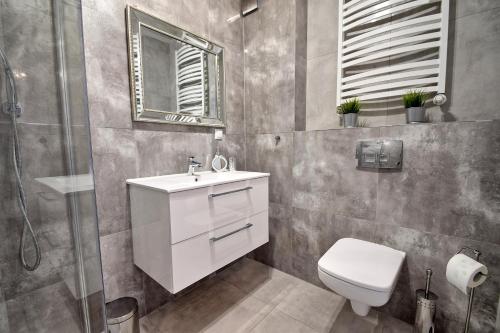 Kúpeľňa v ubytovaní AMD Apartamenty Bliżej Morza