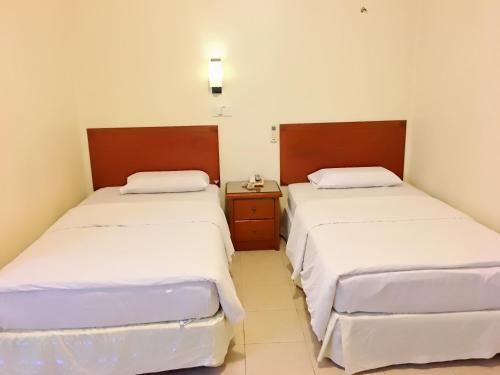 Harbour View Hotel Sekinchanにあるベッド