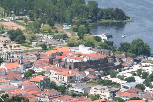 an aerial view of a town next to the water at Casa do Cais Cerveira in Vila Nova de Cerveira