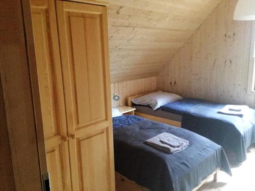 Postel nebo postele na pokoji v ubytování Domki w Borach