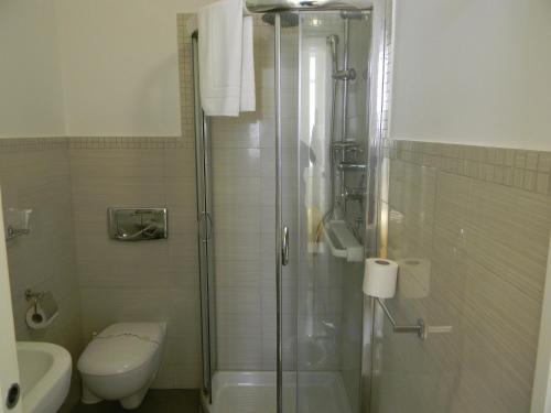 a bathroom with a toilet and a shower stall at Villa Vittoria Tropea B&B in Tropea