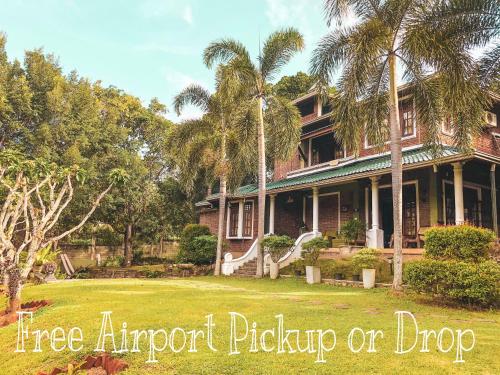 a tree approval pickup or drop off sign in front of a house at Airport Green Olive Villa in Katunayaka