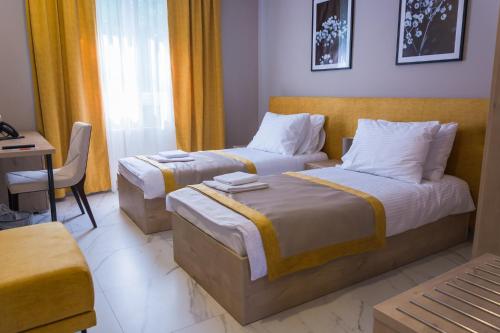 Кровать или кровати в номере Hotel & Distillery Monogram