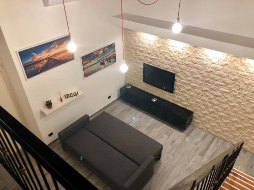 TV a/nebo společenská místnost v ubytování Corte Del Carmine