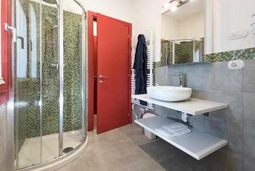 a bathroom with a sink and a glass shower at Barchessa Rossetti in Concordia Sagittaria