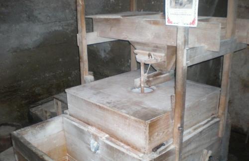 a wooden table with a machine in a room at Xenonas Kypseli in Kipseli