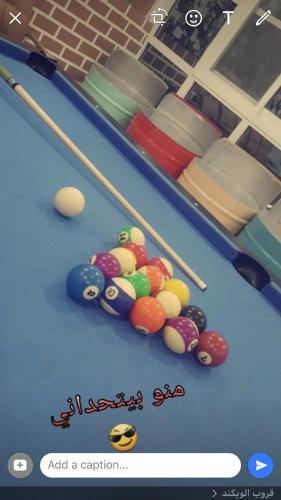 a picture of a pool table with balls on it at Happiness Farm in Hatta