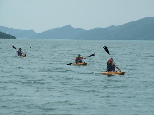 a group of people in kayaks in the water at Xenonas Kypseli in Kipseli