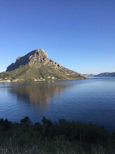an island in the middle of a large body of water at Avra Studios in Masouri