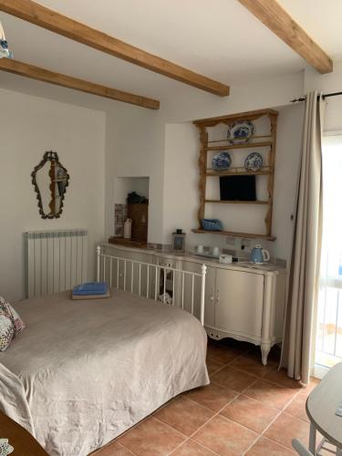 
a bedroom with a bed and a dresser at Borgo dei Pescatori Lecco in Lecco
