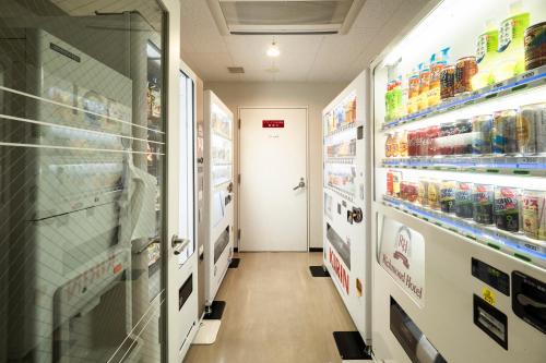 a aisle of a store with shelves of food at Richmond Hotel Utsunomiya-ekimae in Utsunomiya