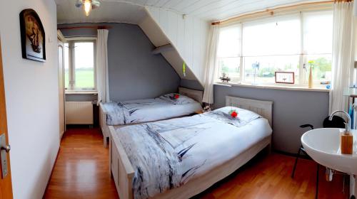 Ένα ή περισσότερα κρεβάτια σε δωμάτιο στο B&B Veluwemeerpension