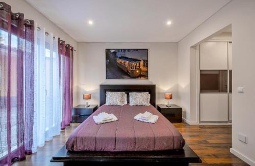 En eller flere senge i et værelse på AZEITÃO DAMAS VILLA