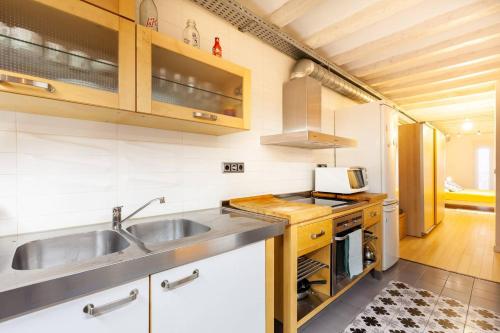 a kitchen with a sink and a stove at Tarragona Circus in Tarragona