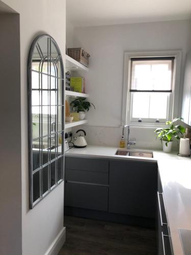 a kitchen with a sink and a window at 19 Chapel Court in Leamington Spa