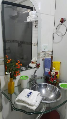 Salle de bains dans l'établissement Apart Hotel em Caxambu207