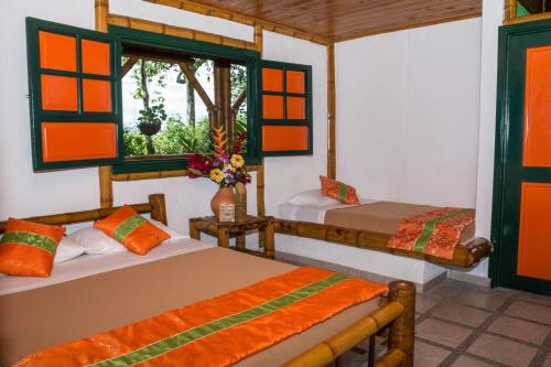 Ένα ή περισσότερα κρεβάτια σε δωμάτιο στο Finca Hotel La Dulcera