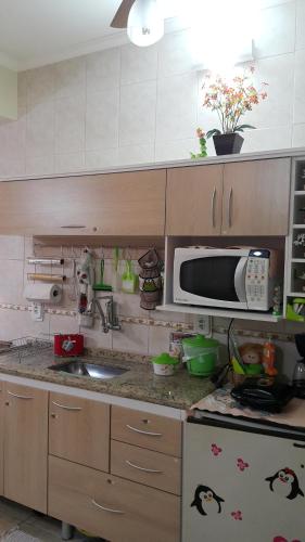 Cuisine ou kitchenette dans l'établissement Apart Hotel em Caxambu207