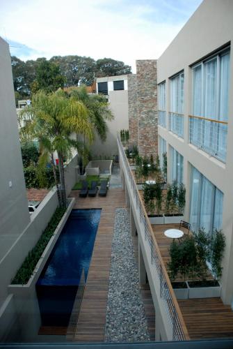 a balcony with a swimming pool on a building at San Isidro Plaza Hotel in San Isidro